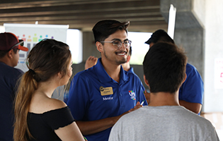 Male LIFE mentor talking with a group